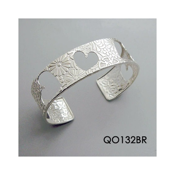TEXTURED CUFF BRACELET WITH CUT OUT HEARTS