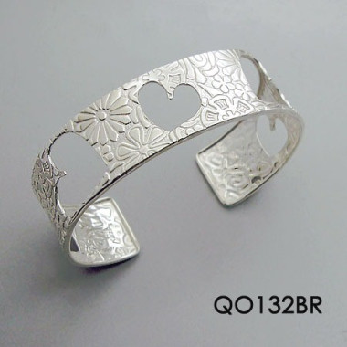 TEXTURED CUFF BRACELET WITH CUT OUT HEARTS